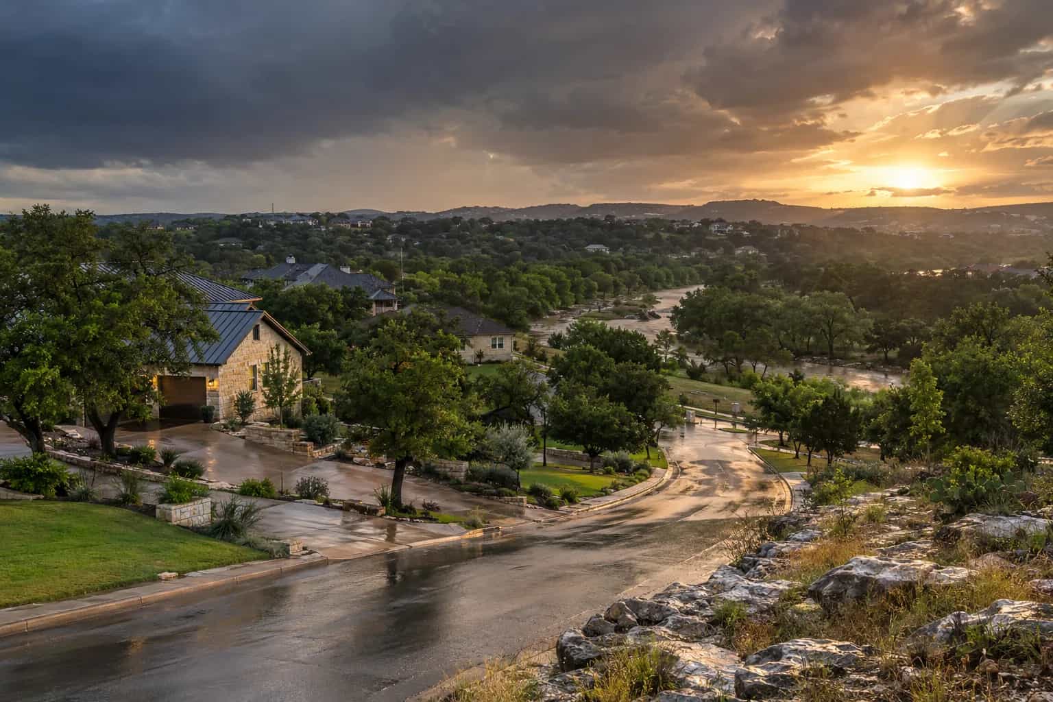 Hill Country homes and live oaks under clearing storm clouds in Hays County near San Marcos, TX